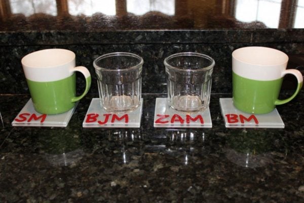 mugs and cups on monogramed coasters