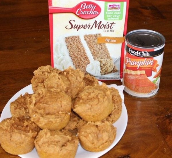 A plate of two ingredient pumpkin muffins - with spice pumpkin mix and a can of pumpkin puree in the background. 