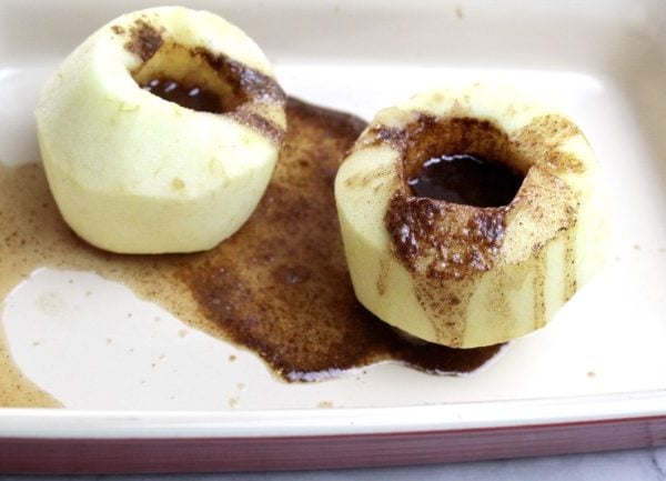 baked apple in pan with sauce