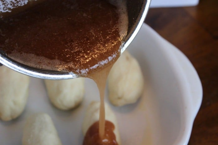 Pour the butter/sugar mixture over the apple dumplings.