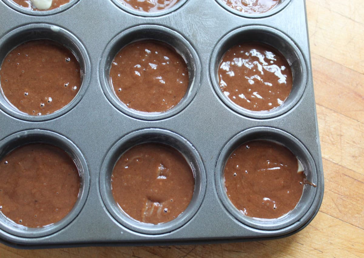 chocolate batter in muffin tins