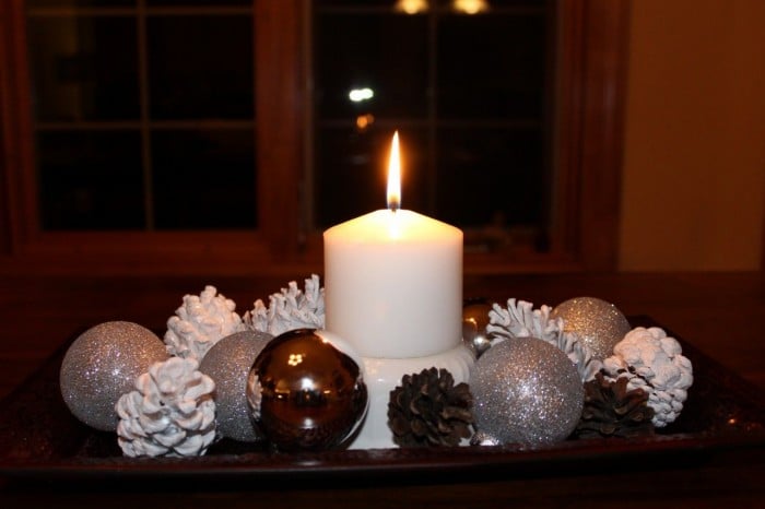 A display using christmas ornaments and my white pinecones.