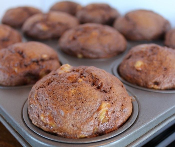 banana chocolate muffins in the muffin tin