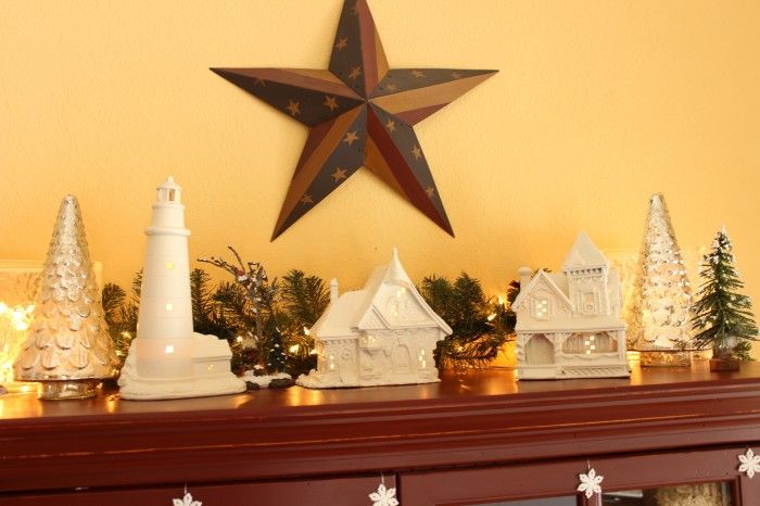 My white painted Christmas homes on top of my kitchen hutch.