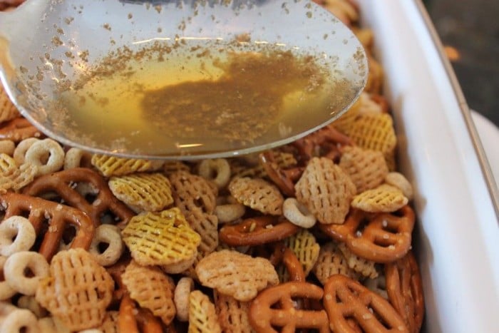 Drizzle the oil and seasoning mixture all over the cereal mixture.