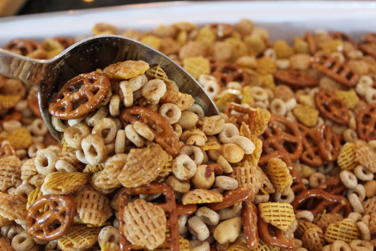 Chex mix being stirred