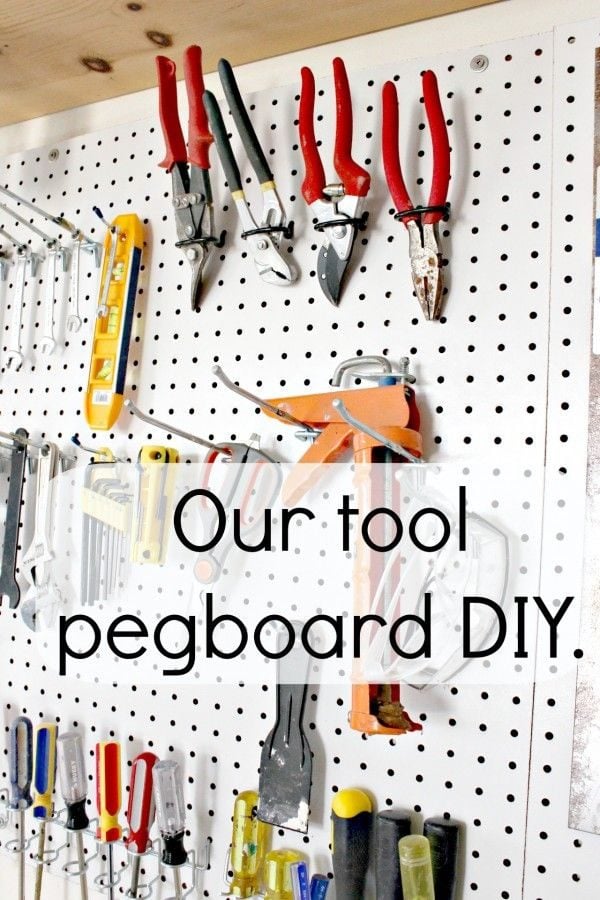 white pegboard with tools stored on it