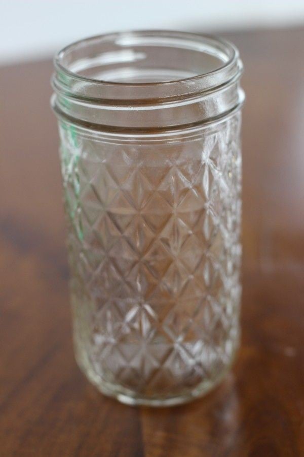 A mason jar with a nice pattern on it.