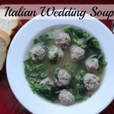 bowl of Italian wedding soup in a white bowl.