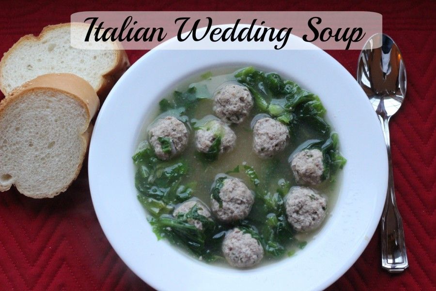 bowl of Italian wedding soup in a white bowl.