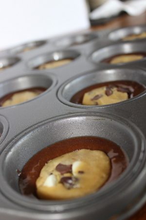 brownie mix on the bottom, cookie dough disk floating on brownie mix.