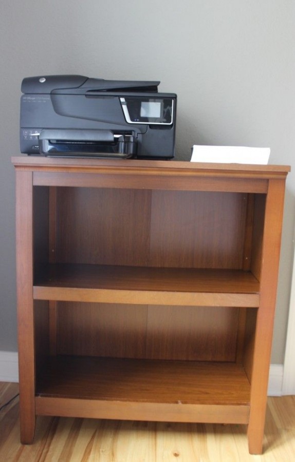 Painting a bookcase white.