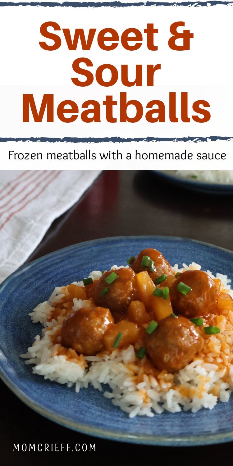 Sweet and sour sauce covered meatballs on a bed of rice. Pineapple tidbits are visible and the dish is garnished with cut up chives.