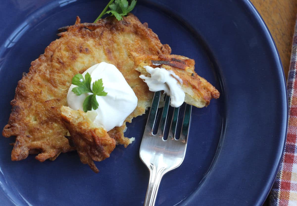 potato pancake garnished with sour cream.