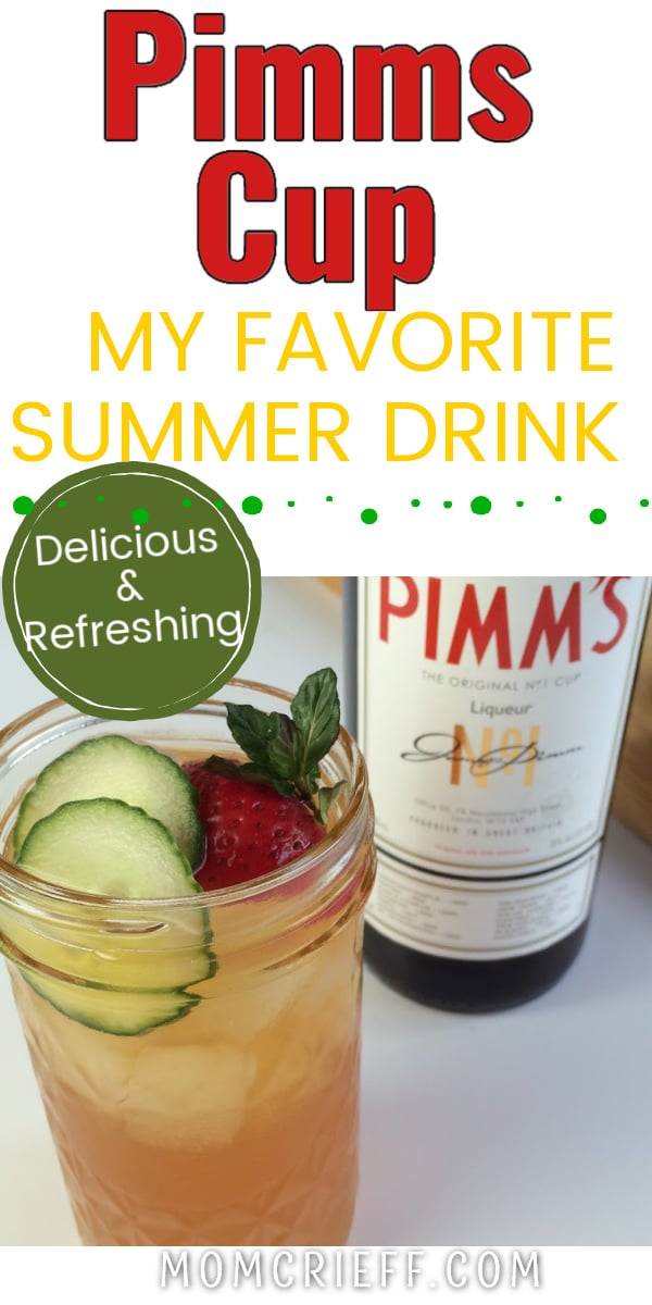 A refreshing glass of pimms garnished with lemon, strawberries and mint.