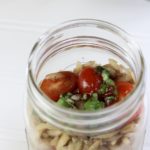 orzo salad with tomatos and fresh basil in a mason jar