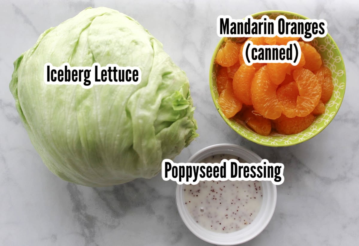 ingredients for mandarin salad.  Includes iceburg lettuce, mandarin oranges and poppyseed dressing.