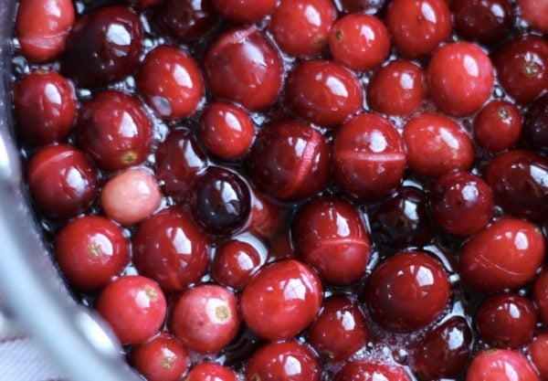skins of cranberries start to split when cooked