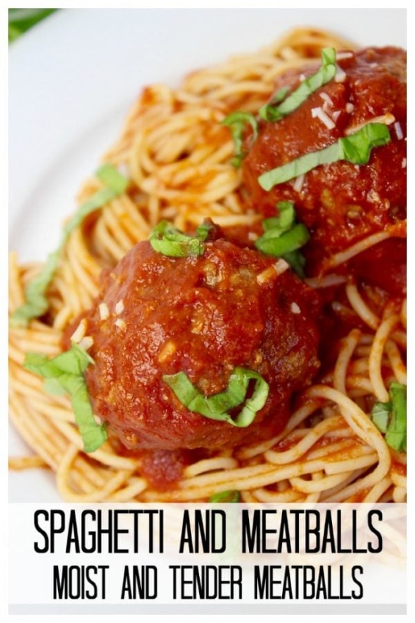 spaghetti with meatballs on a white plate