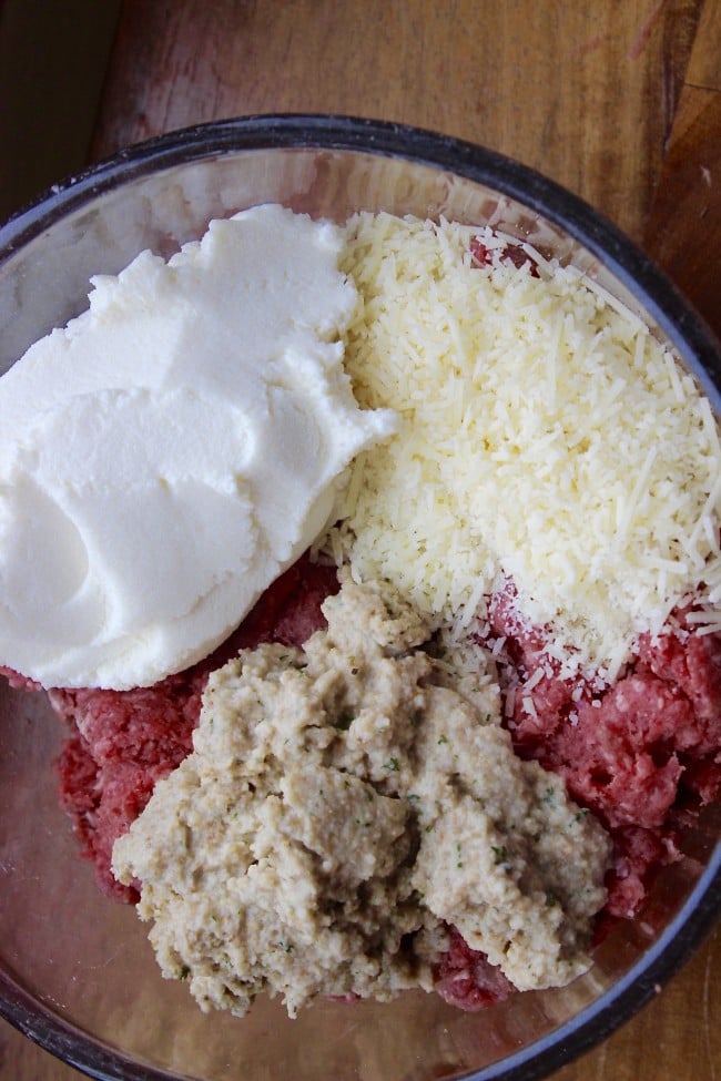 Ingredients for delicious and moist meatballs. The ingredients include ground beef and pork,ricotta cheese, moistened breadcrumbs and parmesan cheese.