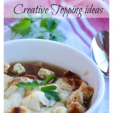 A bowl of French onion soup with croutons and melted cheese