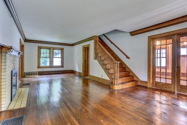 The view as you come into my living room. The beautiful wood floors, trim, stairway and doors.