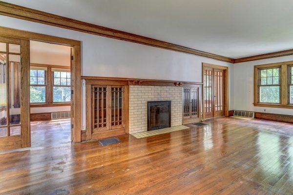 My 1920's living room prior to purchasing the house. A fireplace in the center of the room, two built-ins beside and then french double doors.