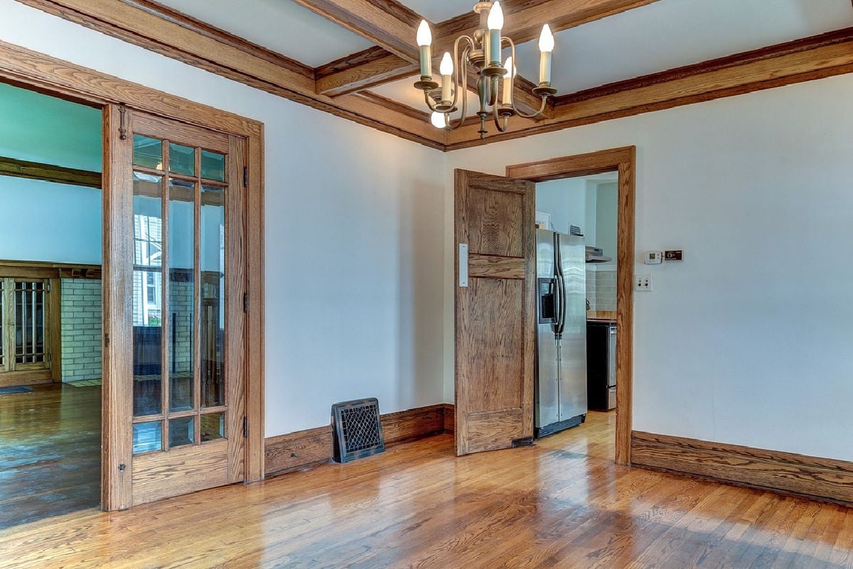 100 year old dining room with beautiful wood floors, and original wood trim.