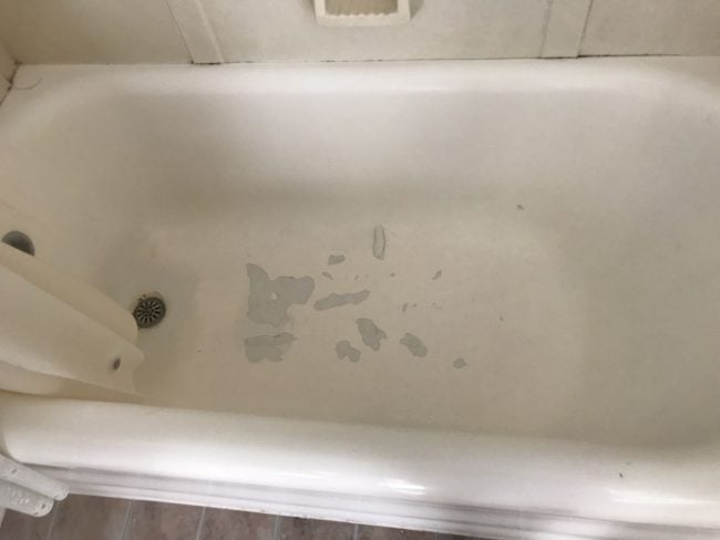 chipped bathtub prior to bathroom remodel