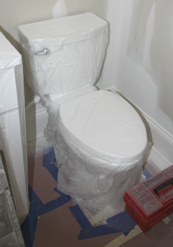 Painting tips. Cover your toilet and other bathroom fixtures in plastic.