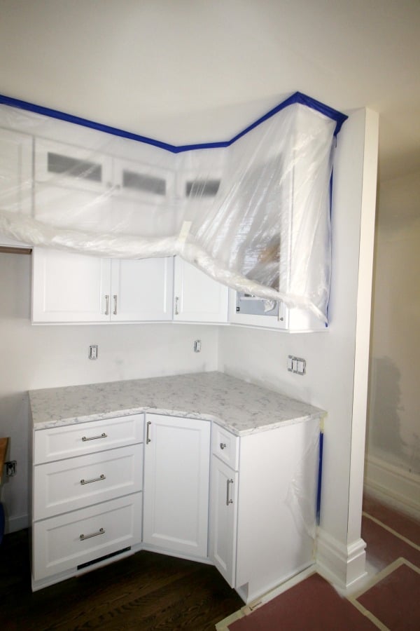 Plastic covering cupboards prior to painting.