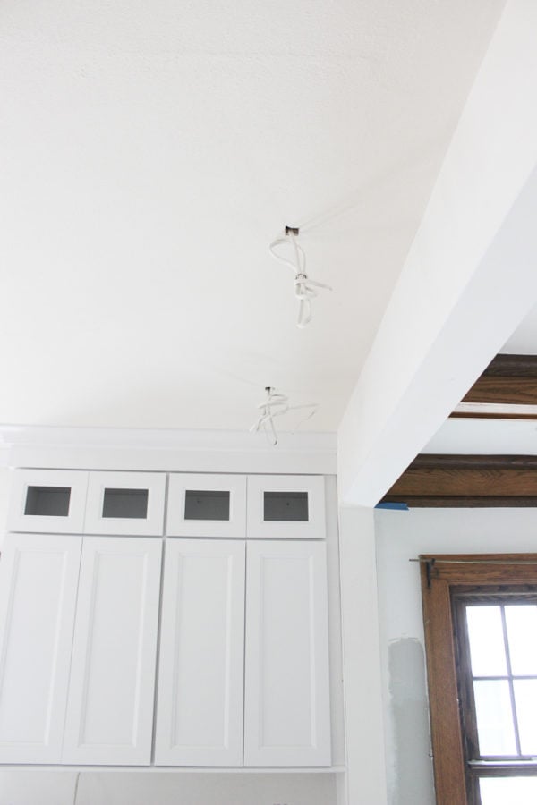 electrical wiring roughed in and hanging from kitchen ceiling