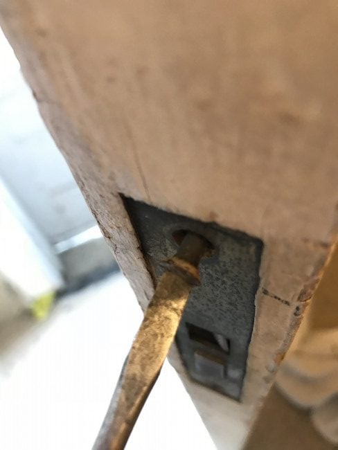 unscrewing the plate accessing the mortise lock
