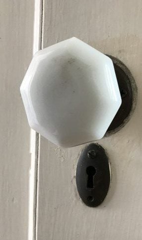white doorknob from kitchen to basement