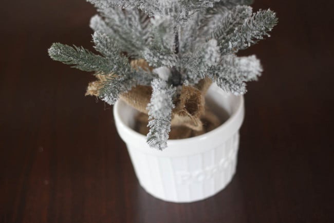 Small flocked tree placed into popcorn bowl.