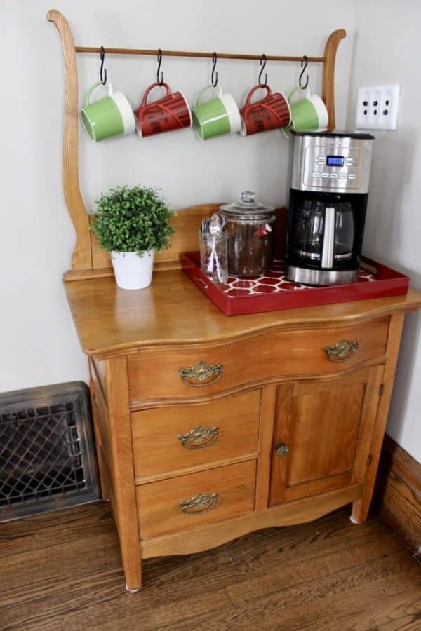 A coffee bar created from a vintage piece of bedroom furniture.