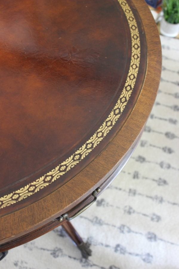a closeup of the leather trimmed inlay on my vintage wooden living room table