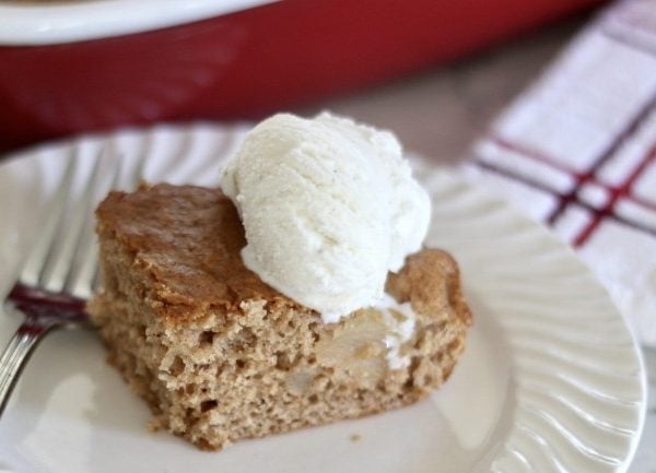 three ingredient apple cake with a scoop of vanilla cake on top.