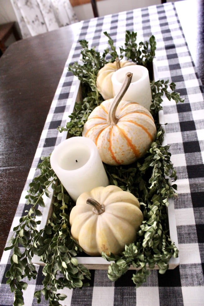 fall centerpiece on antique dining table