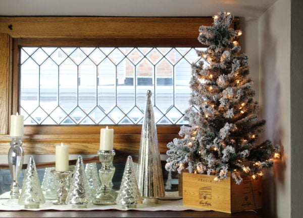 Small flocked Christmas tree with mercury glass trees in my dining room.