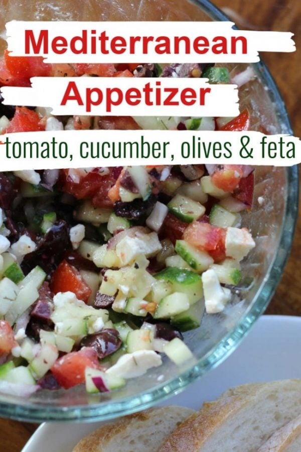 mediterranean appetizer with chopped tomato, cucumber, olives and feta