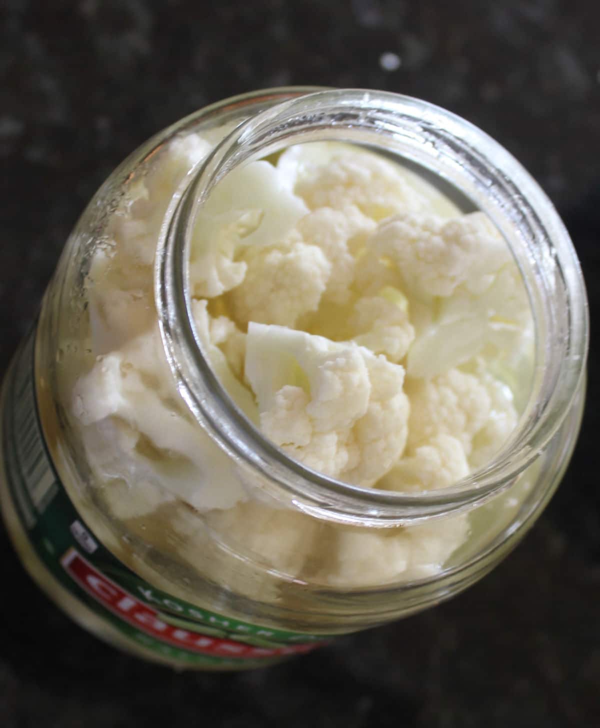 cauliflower in a used pickle container