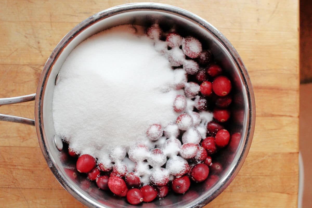 Sugar on cranberries in a pot