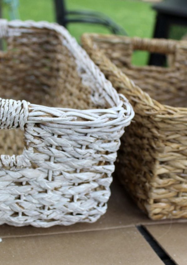 A white painted wicker basket beside the twin plain basket