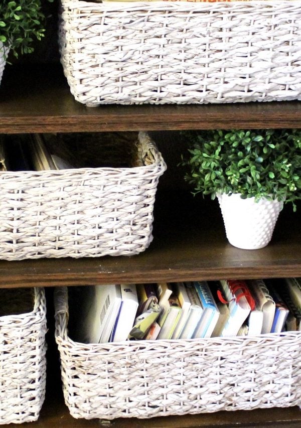 white painted wicker baskets in a dark built-in