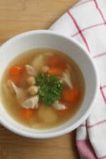 chicken soup with chickpeas garnished with parsley