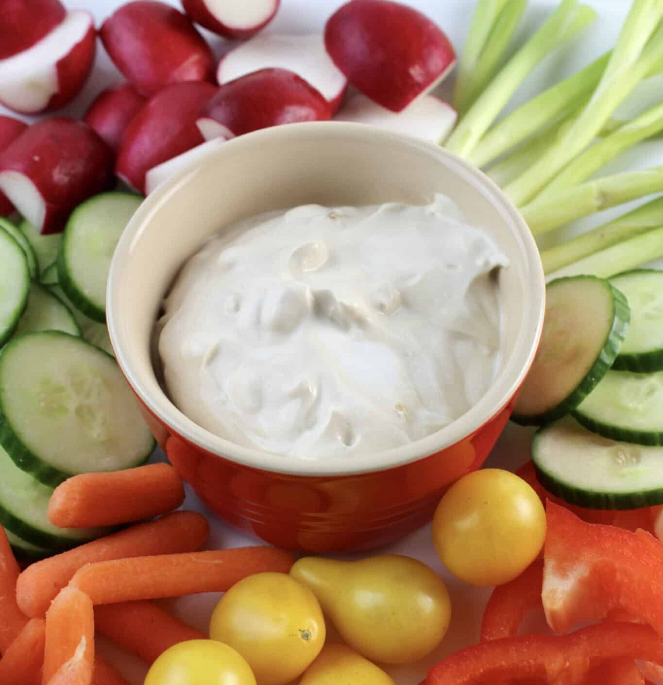 vegetable dip in the center of raw vegetables