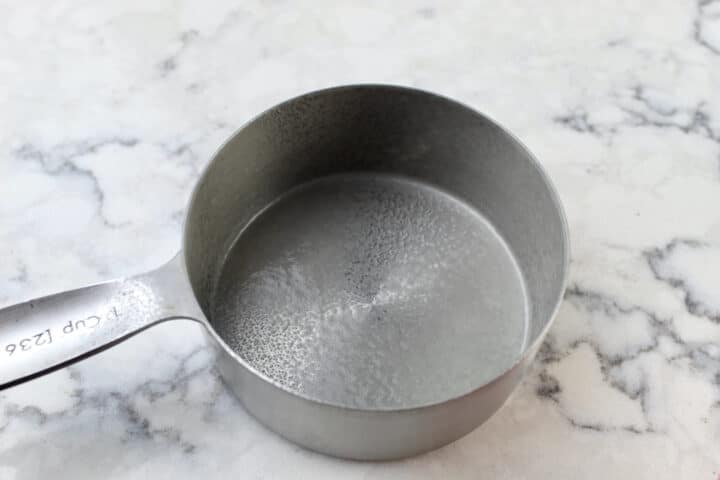 Measuring cup with cooking spray