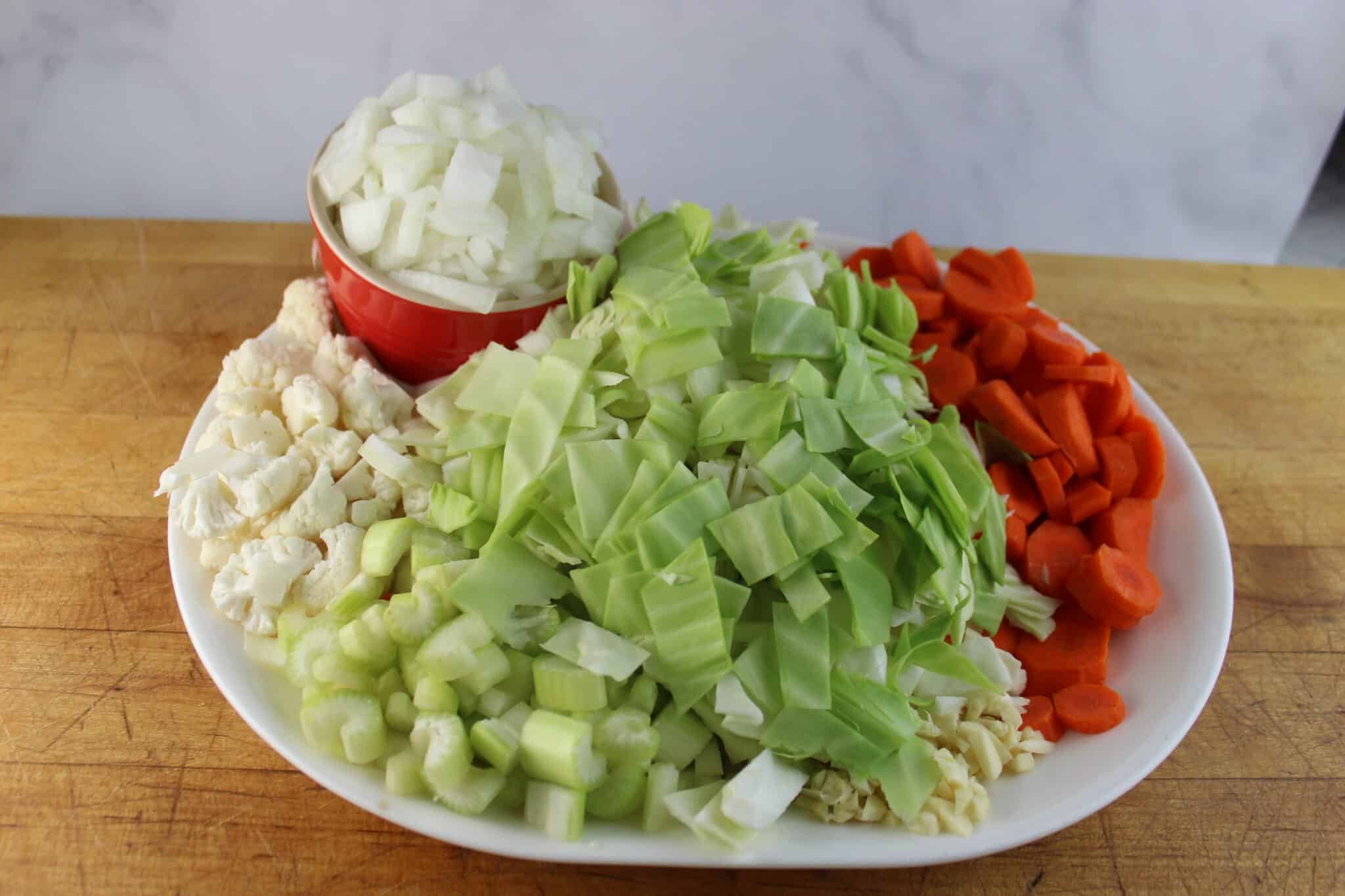chopped green cabbage, onions, carrots and celery for cabbage soup