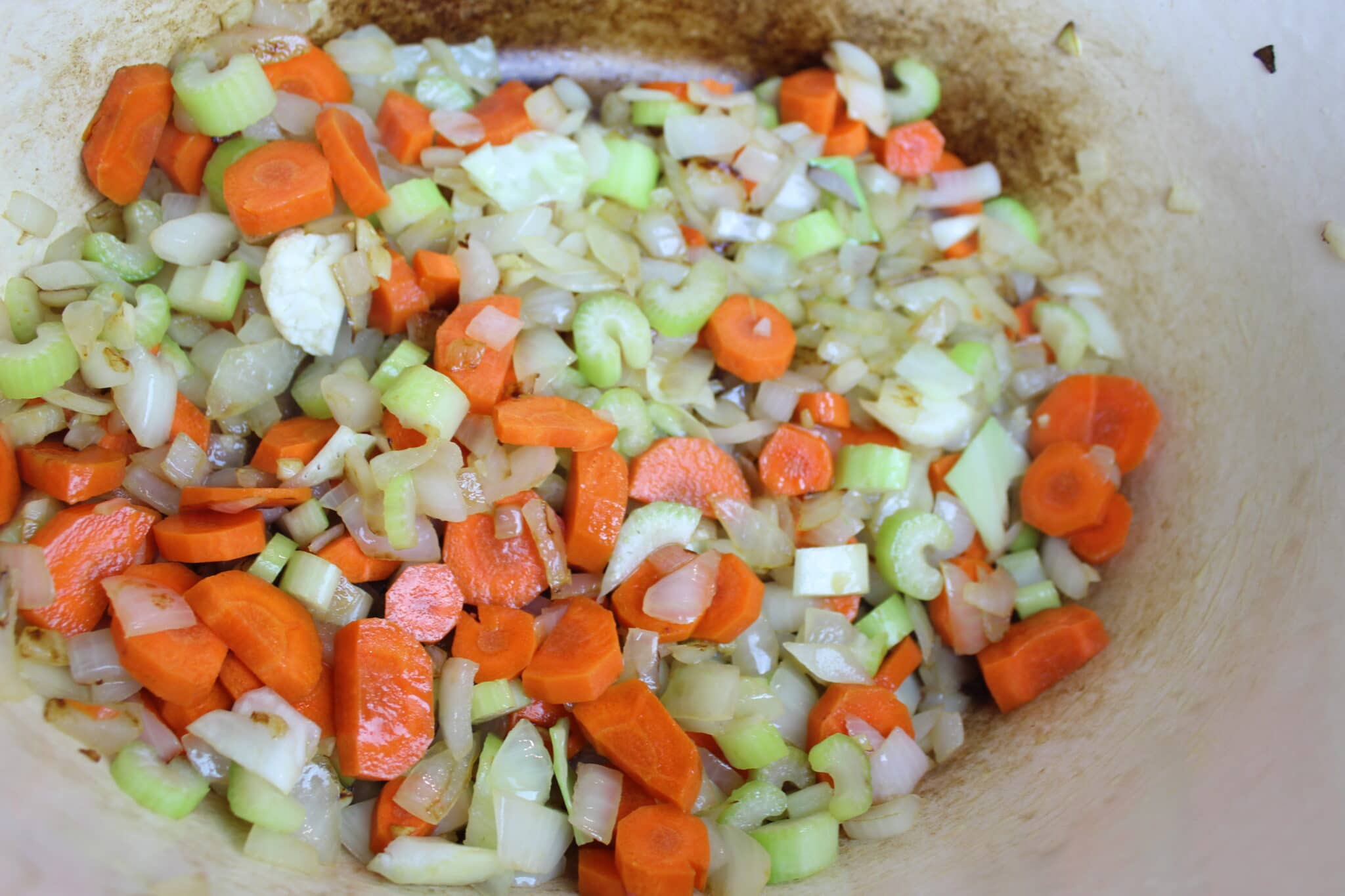 cooking onions, carrots and celery